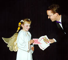 Richard Young the Magician doing magic at a Halloween party.