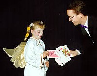 Helper picking a jumbo card from Richard Young the Magician